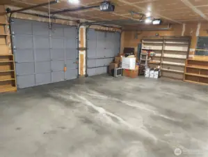 Attached garage is EXPANSIVE and includes wall-to-wall storage areas, workshop and extra appliances.