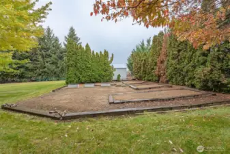 Oversize garden space located conveniently near the shop. Bring your green thumb and learn how to live sustainably!