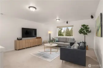 The spacious upstairs loft offers versatile use as a media room, play area, or second living space, featuring automatic blinds for enhanced convenience and privacy.