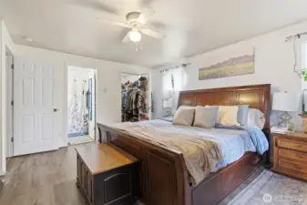 Upstairs primary bedroom- back right is walk-in closet, left is the primary bathroom