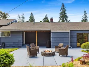 Entertainment-sized back patio with firepit.