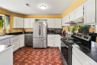 Kitchen has stainless steel appliances and tons of storage!
