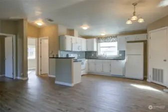 Utility/laundry room is to the right of the kitchen.