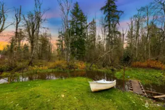 This pond runs along the backside of the property, there are multiple bridges and access points to get across. Spring and summer its filled with frogs and plenty of wildlife come to visit you here! Makes for such a beautiful serene setting