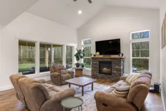 Main living area has valuated ceilings and tons of light with propane fire place to keep you cozy.