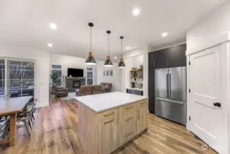 You can enjoy cooking in this kitchen without missing a moment of the fun, perfect for entertaining! Just to the left is your access to private covered 12x12 patio