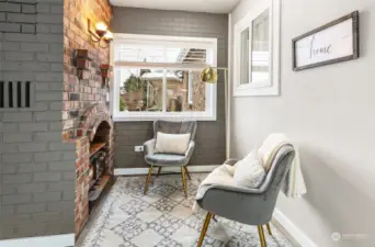 Wood burning stove provides a cozy ambiance in the sun room.