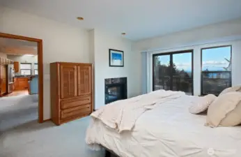 Your Primary Suite is located off of the Living Room. Entrance to your spacious bathroom is behind you. Propane double sided fireplace is shared with the Living Room.