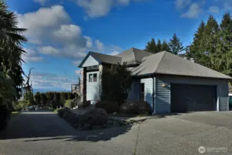 Two-car garage, mature landscaping, and located at the end of the road.
