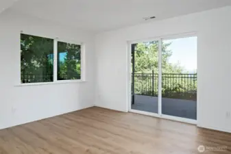 Dining space in the downstairs living quarters offers easy access to the expansive lower deck to enjoy the water views!