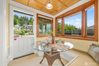 Exterior entry with a Dutch door on the street, east, side of the breakfast room. There's a deck on the west side with gas for a BBQ.