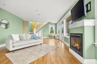 Stairway form the 1st floor leads down to this family or recreation room with a gas fireplace. When the owner purchased the home this area had an indoor swimming pool. Yes, really!