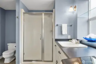 Modern 3/4 bath with laundry.