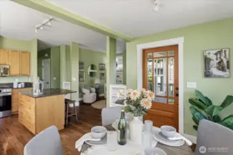 The luxury glass and cedar entry door opens to the dining area and kitchen.