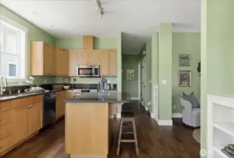 Large, granite topped island for your convenience with room for eating at the bar.