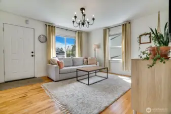 Each room is well lit. Windows are outfitted with both custom blinds and curtains.