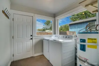 Laundry room opens to then backyard.