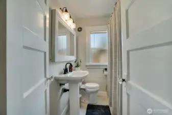 Fully upgraded bathroom on the main floor. New tile tub surround, lighting and timeless penny round floors