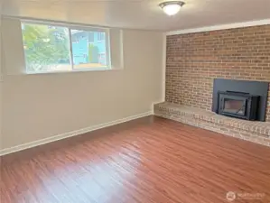 Basement family room in the fully finished lower level at 16312 127th Pl SE, Renton—updated with fresh paint and new flooring; flexible space in Cascade 98058.