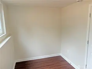 Basement flex room in the fully finished lower level at 16312 127th Pl SE, Renton—ideal for a craft/hobby room, home office, or guest space; fresh paint and new flooring in Cascade 98058.