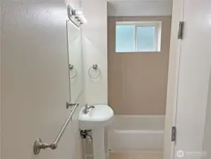 Basement full bathroom in the fully finished lower level at 16312 127th Pl SE, Renton—updated, clean finishes; convenient to family room and flex space in Cascade 98058.