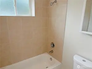 Lower-level full bath serving the basement family room and flex room—fresh, functional, and part of this updated split-level in Renton’s Cascade neighborhood 98058.