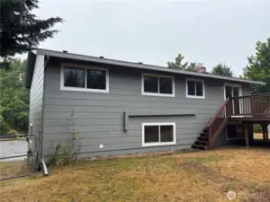 Open backyard with room for garden beds, play, or pets (buyer to verify use)—quiet setting in Cascade, Renton 98058.