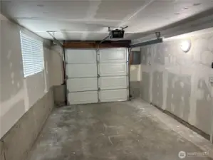Interior view of the extra-deep garage showing parking plus workspace/storage potential—updated split-level in Cascade, Renton WA 98058.
