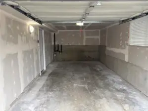 Alternate angle of the attached garage highlighting extra-deep length—room for a vehicle plus gear and projects at 16312 127th Pl SE, Renton.