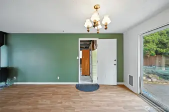 View from eating area to door to 2-car carport