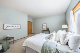 Elegant double doors welcome you into the spacious primary suite.