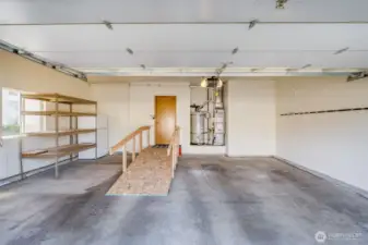 Bonus storage shelf and extra refrigerator are included with the home for added convenience.
