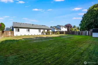 The spacious backyard is perfect for relaxing, playing, or entertaining outdoors.