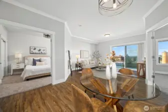 The second bedroom with double french doors is seen to the left