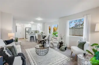 Multiple windows on this end unit provide ample natural light throughout this great room concept.