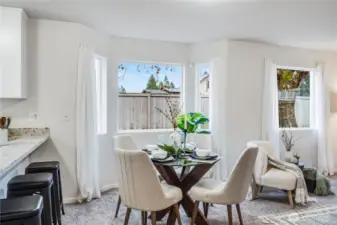 The dining area is adjacent to the kitchen. Or, just use the stools at the countertop for casual meals.