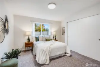 The primary suite of the home features a double closet and a private, updated bath.