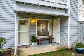 Out the back door of the home is a delightful covered patio, ideal for enjoying the out of doors anytime year round.
