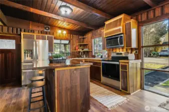 Open concept kitchen with stainless appliances