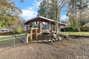 Foor to ceiling windows with great views of your yard.  Huge gate to bring your boat, RV inside & easy access for building