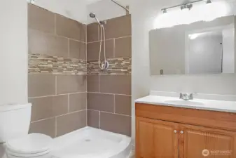 The second of two 3/4 bathrooms (showers only; neither bathroom has a tub).