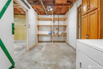 Lots of extra storage - perfect as a pantry area. The sliding door on the left leads to the garage, and the door on the right leads to the house.
