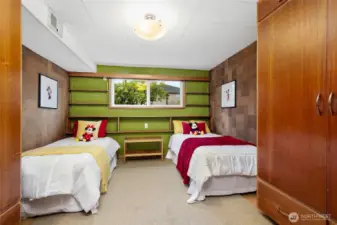 Additional bedroom downstairs with 2 built in wardrobe closets and cork walls