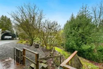 Lower part of yard to play ball, croquet, gardening or whatever suits your outdoor enjoyment