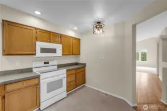 The kitchen is easily accessible from the dining and living areas.