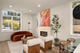 Sun-drenched open-concept living area featuring expansive windows and modern finishes.