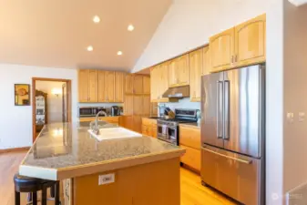 Chef's kitchen with lots of prep area and generous refrigerator, Propane range, double oven.