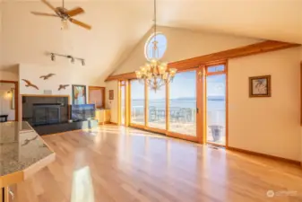 Great room with windows and doors to expansive view and decks to enjoy the view outdoors.