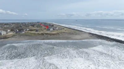 AERIAL OF THE OCEAN TOWARD THE BEACHES AND THEN TO THE CONDO (RED ARROW)!