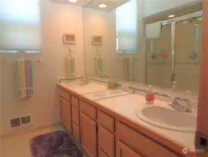 PRIMARY BATH CONTINUES WITH CANNED LIGHTING, HUGE VANITY WITH DOUBLE SINKS AND TILE FLOORING!